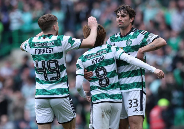 Matt O'Riley of Celtic congratulates Kyogo Furuhashi after he scores his second goal during the Cinch Scottish Premiership match between Celtic FC ...