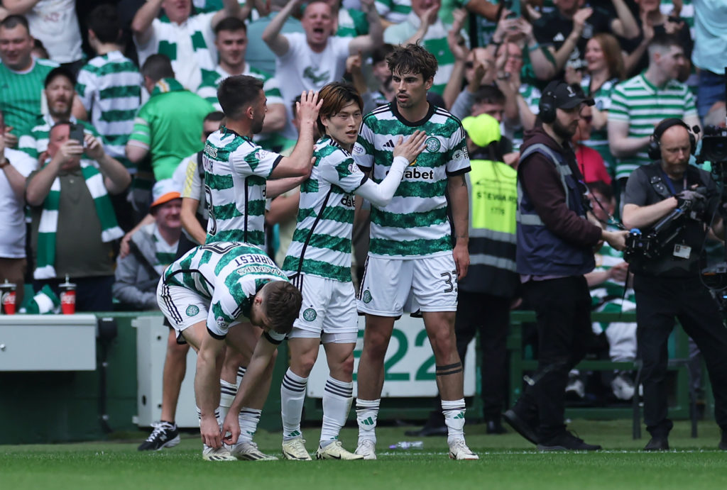 Matt O'Riley of Celtic celebrates scoring his team's first goal with teammates during the Cinch Scottish Premiership match between Celtic FC and Ra...