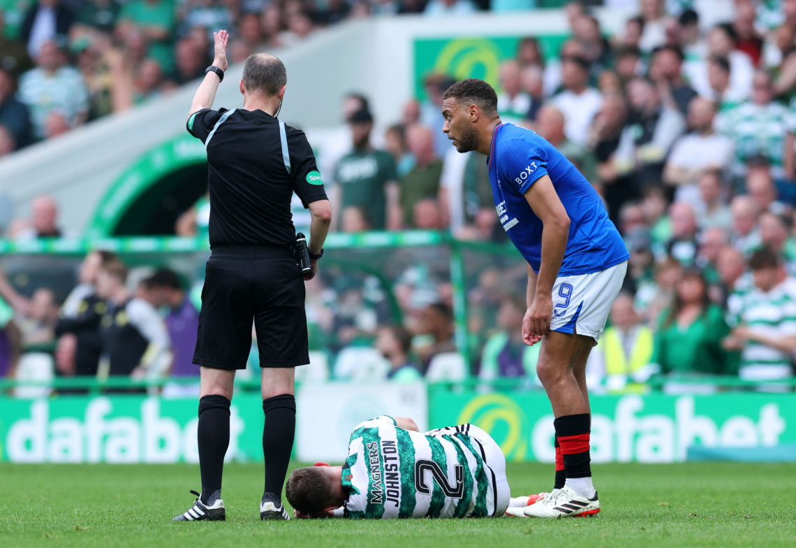 Alistair Johnston of Celtic goes down with an injury during the Cinch Scottish Premiership match between Celtic FC and Rangers FC at Celtic Park St...
