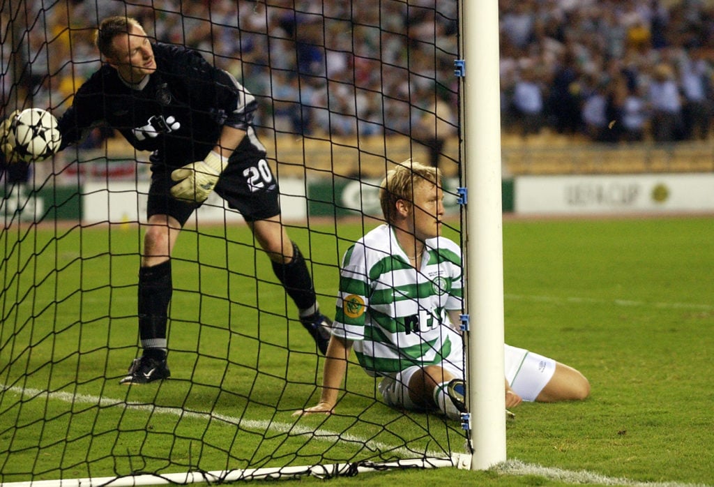 A dejected Ulrik Laursen and Robert Douglas of Celtic after the winning goal goes in