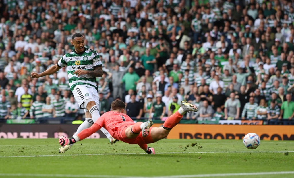 Adam Idah of Celtic scores his team's first goal past Jack Butland of Rangers during the Scottish Cup Final match between Celtic and Rangers at Ham...