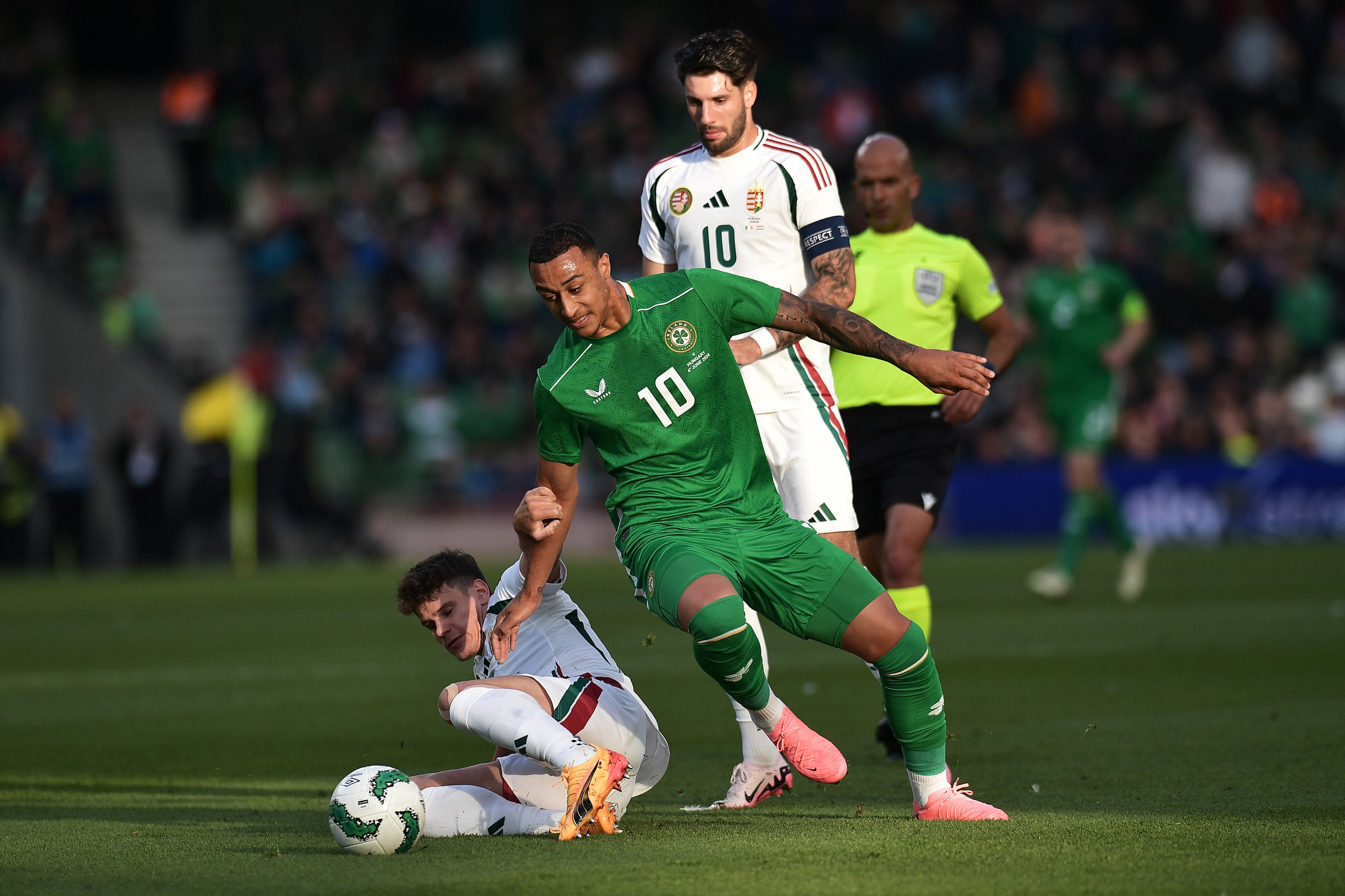 Adam Idah of Republic of Ireland battles for possession with Milos Kerkez of Hungary during the international friendly match between Republic of Ir...