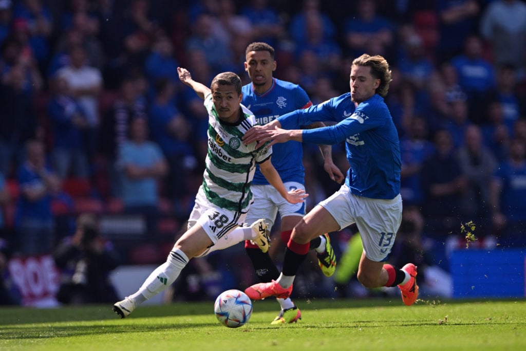 Daizen Maeda of Celtic is challenged by Todd Cantwell of Rangers during the Scottish Cup Final match between Celtic and Rangers at Hampden Park on ...