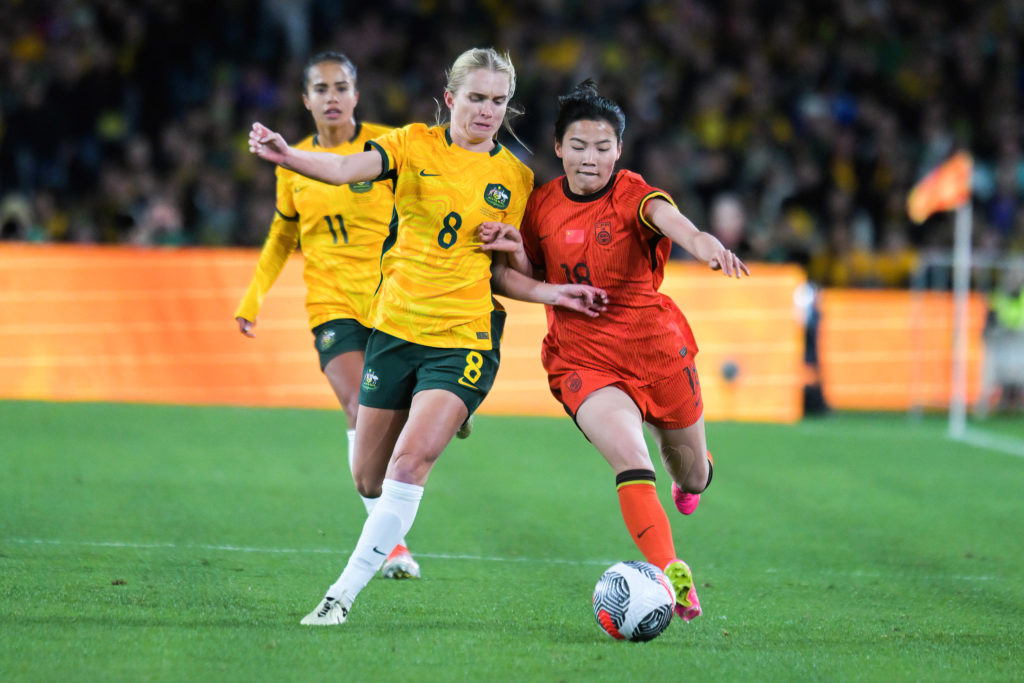 Kaitlyn Torpey (L) of Australia women football team and Shen