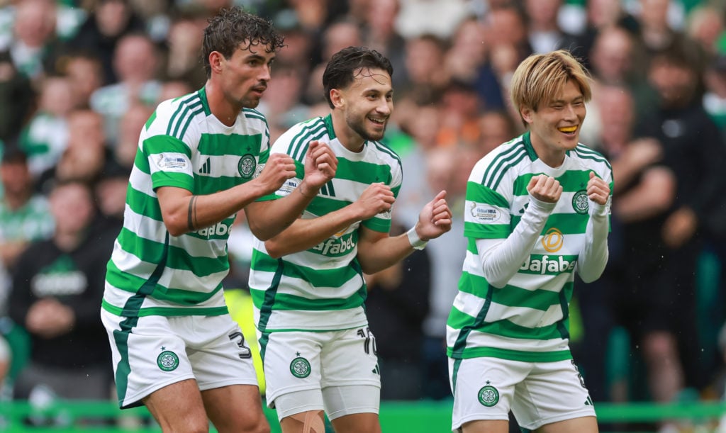 Celtic's Nicolas Kuhn (middle)celebrates his goal with Matt O'Riley and Kyogo Furuhashi during the cinch Premiership match between Celtic FC and Ki...