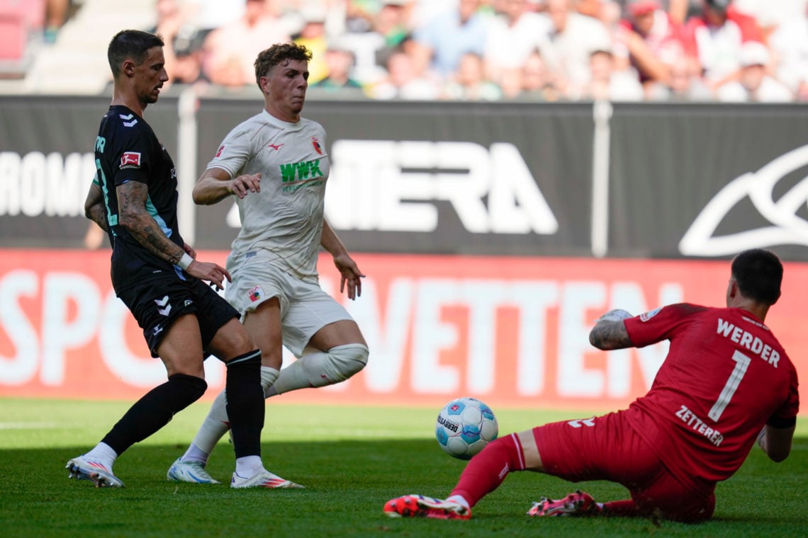 Arne Engels of Augsburg is put under pressure by Marco Friedl of Bremen during the Bundesliga match between FC Augsburg and SV Werder Bremen at WWK...