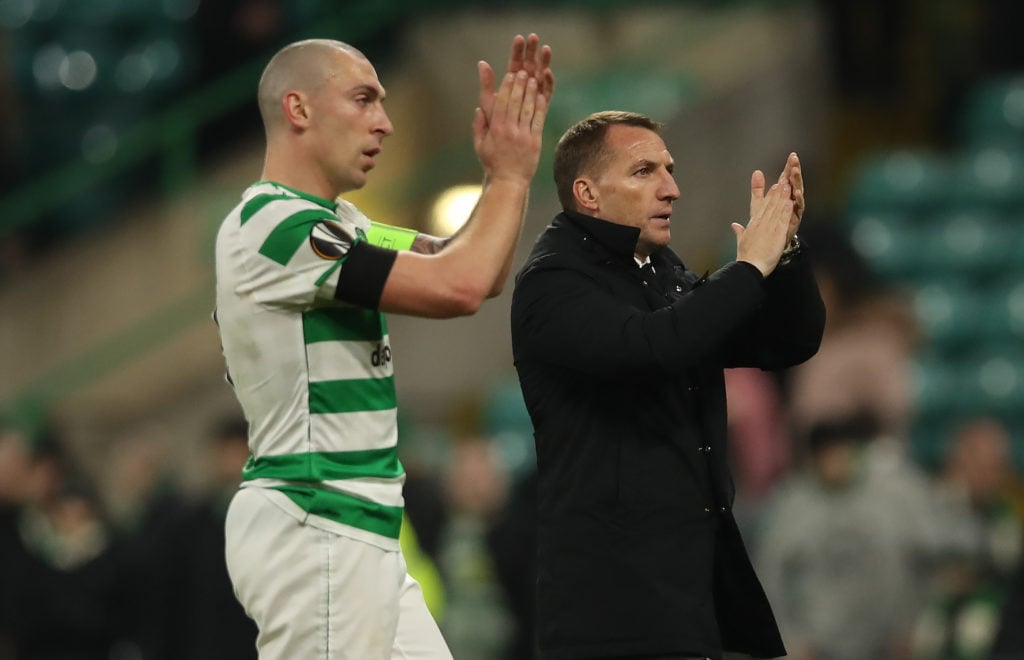 Scott Brown and Celtic manager Brendan Rodgers are seen during the UEFA Europa League Round of 32 First Leg match between Celtic and Valencia at Ce...