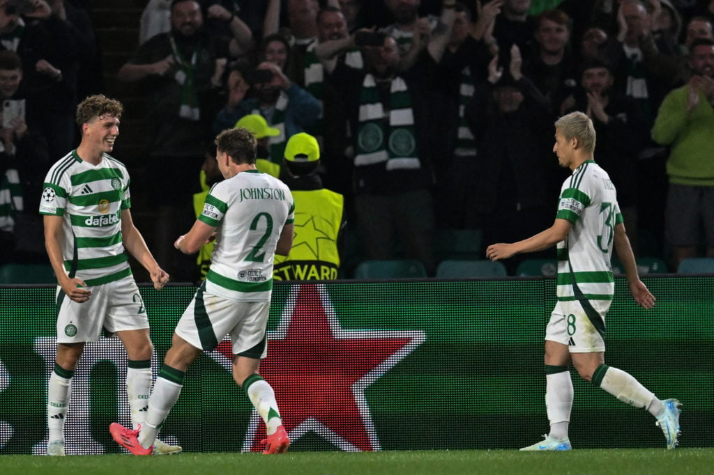 Celtic's Belgian midfielder #27 Arne Engels (L) celebrates after scoring a penalty and his teams third goal during the UEFA Champions League, leagu...