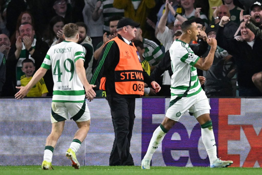 Celtic's Irish striker #09 Adam Idah (R) celebrates after scoring a goal during the UEFA Champions League, league phase football match between Celt...