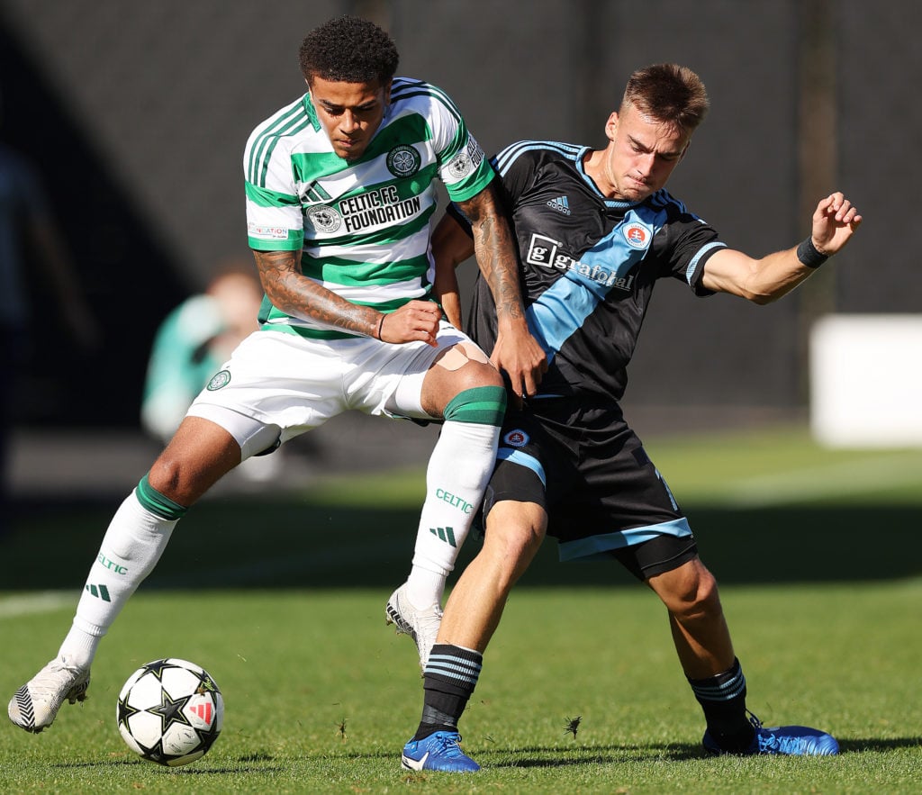 Josh Dede of Celtic vies with Maxime Denko of SK Slovan Bratislaval during the Celtic v Slovan Bratislava - UEFA Youth League 2024/25 match at The ...