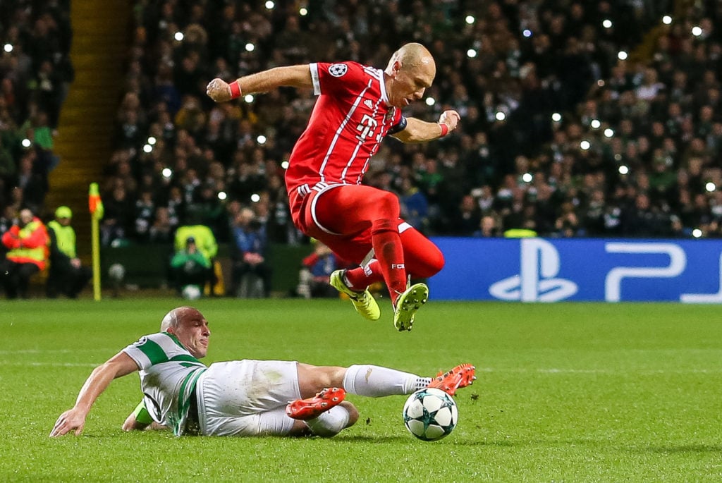 Scott Brown of Celtic and Arjen Robben of Bayern Munich battle for the ball during the UEFA Champions League group B match between Celtic FC and Ba...