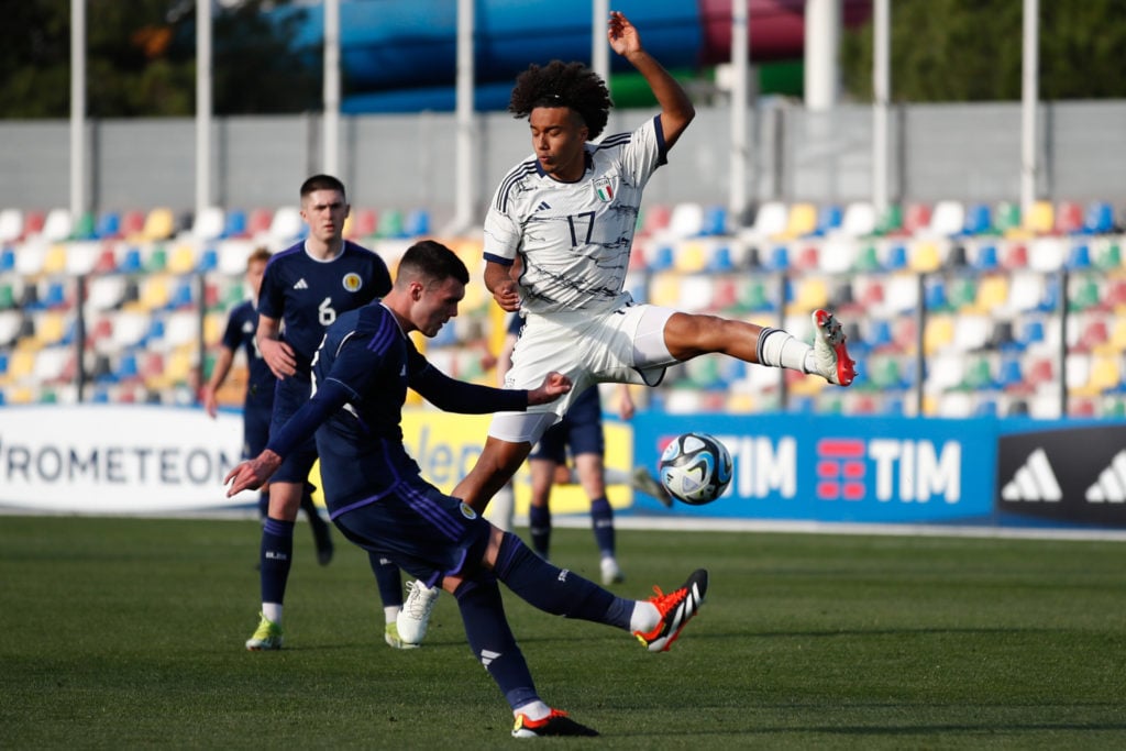 Italy's Aaron Ciamaglicella attempts to block Scotland's Lennon Miller's pass during Scotland U19's EURO 2024 Elite Round qualifier...