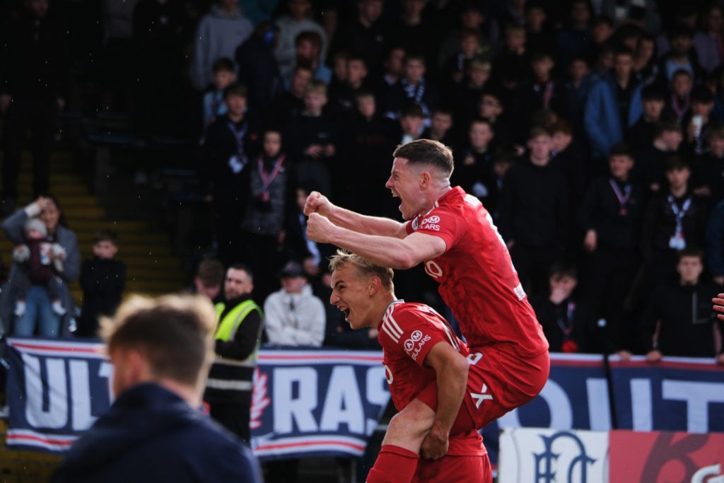 Aberdeen's Topi Keskinen celebrates with Kevin Nisbet after scoring to make it 2-0 during a  during the William Hill Premiership match between Dund...