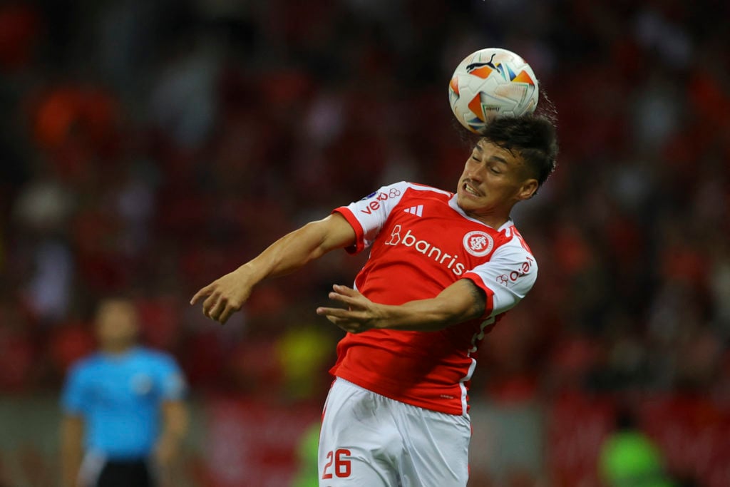 Internacional's Argentine defender Alexandro Bernabei heads the ball during the Copa Sudamericana group stage first leg match between Brazil's Inte...