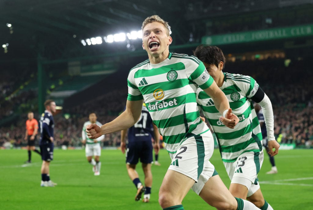 Alistair Johnston of Celtic celebrates scoring his side's first goal during the William Hill Premiership match between Celtic FC and Dundee FC at C...