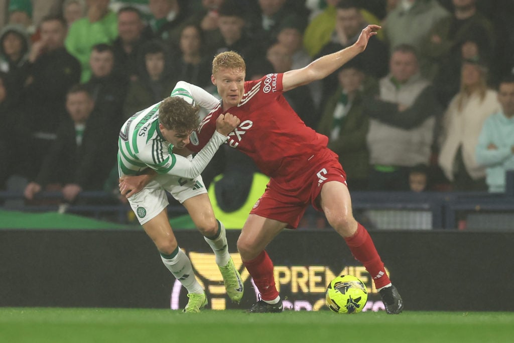 Sivert Heltne Nilsen of Aberdeen is challenged by Arne Engels of Celtic during the Premier Sports Cup Semi-Final match between Celtic and Aberdeen ...