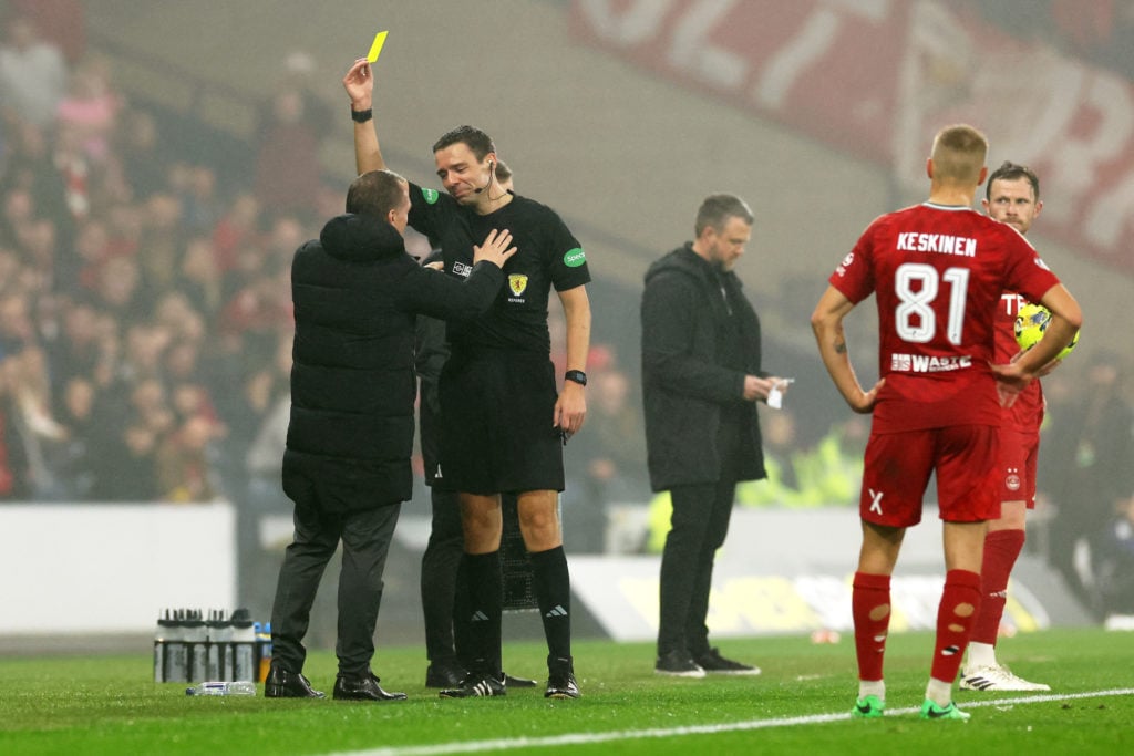 Brendan Rodgers, Manager of Celtic, receives a yellow card from referee Kevin Clancy during the Premier Sports Cup Semi-Final match between Celtic and Aberdeen at Hampden Park