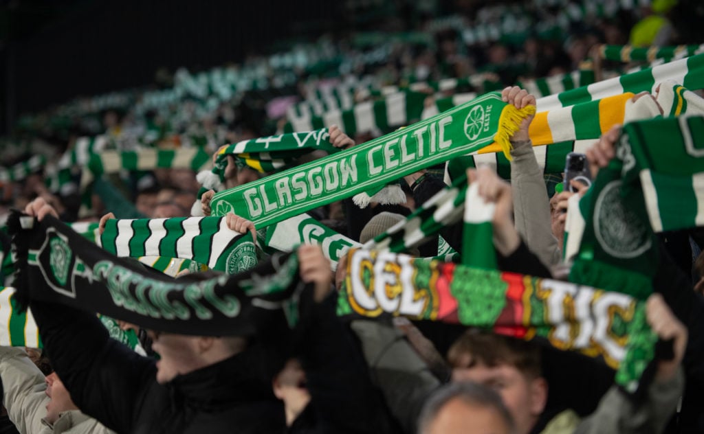 Fans of Celtic hold up scarves to show support for their team prior to the UEFA Champions League 2024/25 League Phase MD4 match between Celtic FC a...