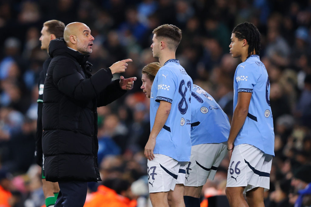 Josep 'Pep' Guardiola, manager of Manchester City, issues instructions to James McAtee, Jahmai Simpson-Pusey of Manchester City during the UEFA Champions League 2024/25 League Phase MD5 match between Manchester City and Feyenoord at City of Manchester Stadium