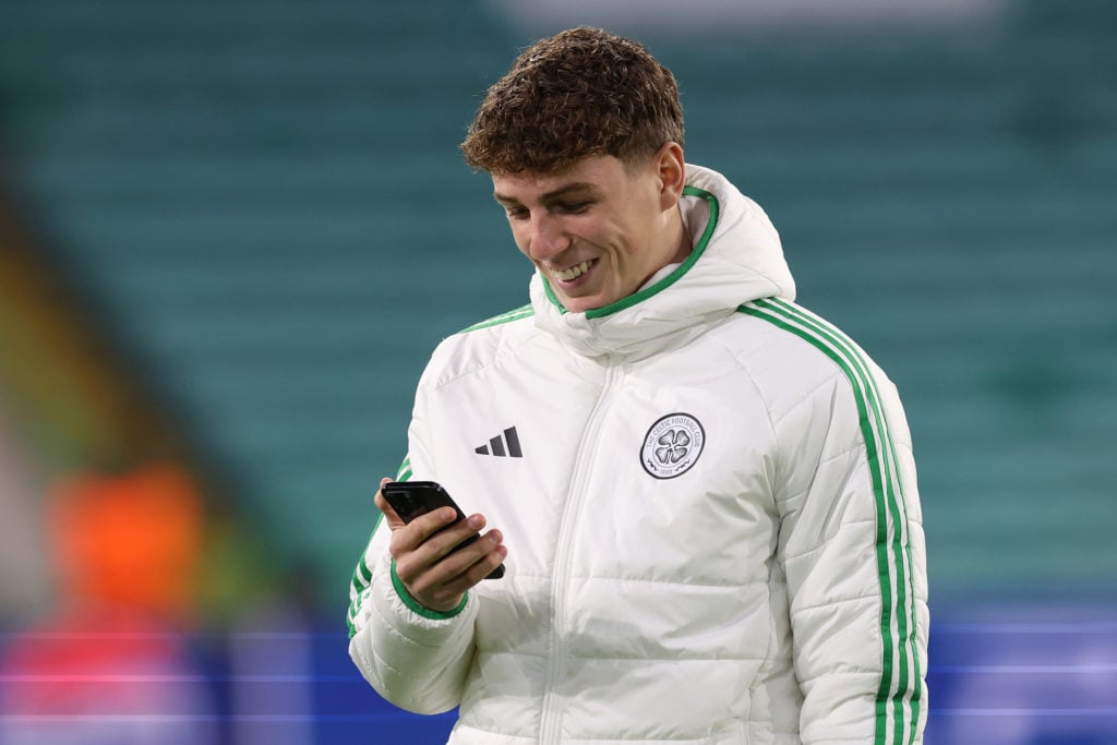 Arne Engels of Celtic FC, uses his mobile phone, during a pitch inspection prior to the UEFA Champions League 2024/25 League Phase MD5 match betwee...