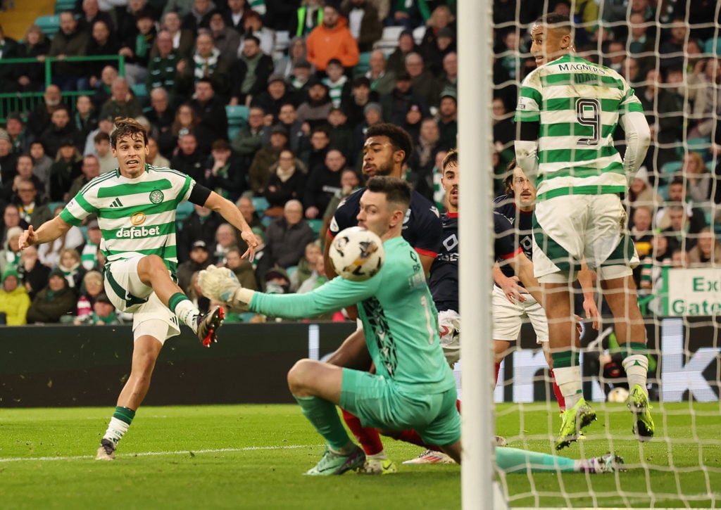 Paulo Bernardo of Celtic scores his team's third goal during the William Hill Premiership match between Celtic FC and Ross County FC at Celtic Park...