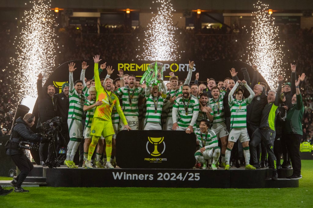 Callum McGregor of Celtic lifts the Premier Sports Cup trophy with his team mates and coaching staff during the trophy lift following the Premier S...