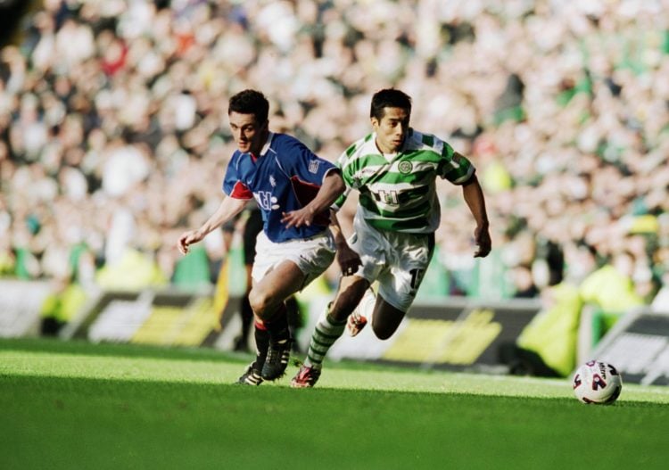 25 Nov 2001:  Bobby Petta of Celtic takes the ball past Maurice Ross of Rangers during the Scottish Premier Division match played at Celtic Park, i...