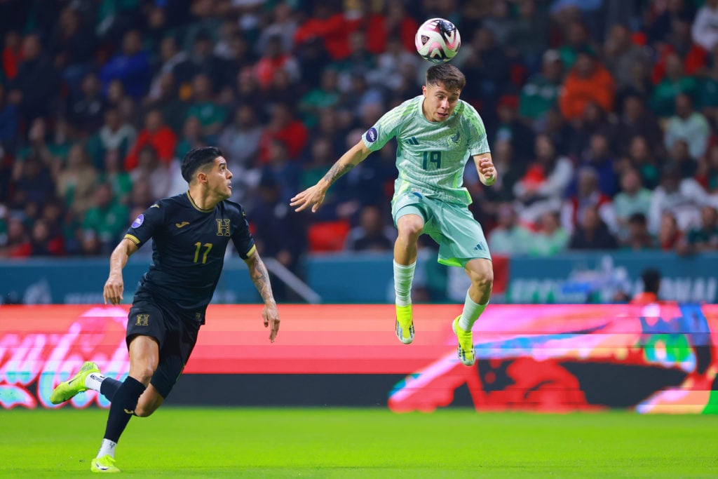 Luis Palma of Honduras battles for possession with Rodrigo Huescas of Mexico during the CONCACAF Nations League match between Mexico and Honduras a...