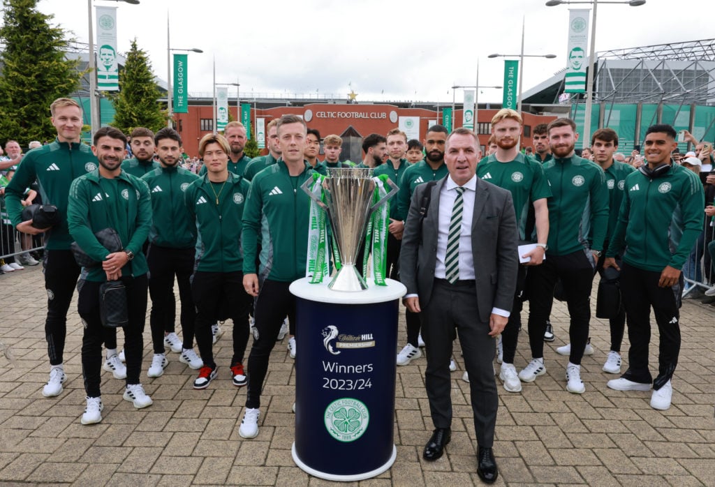 Brendan Rodgers Celtic manager and his players pose for a team picture with the SPFL Scottish League trophy before the cinch Premiership match betw...