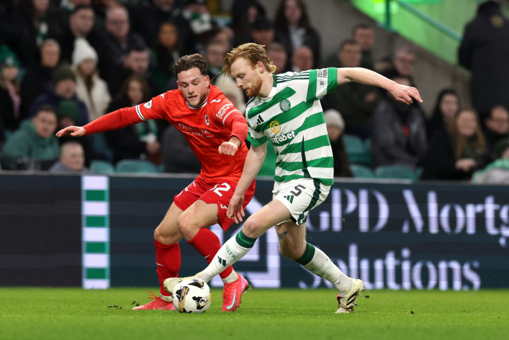 Liam Scales of Celtic runs with the ball whilst under pressure from Jamie Gullan of Raith Rovers during the Scottish Gas Scottish Cup match between...