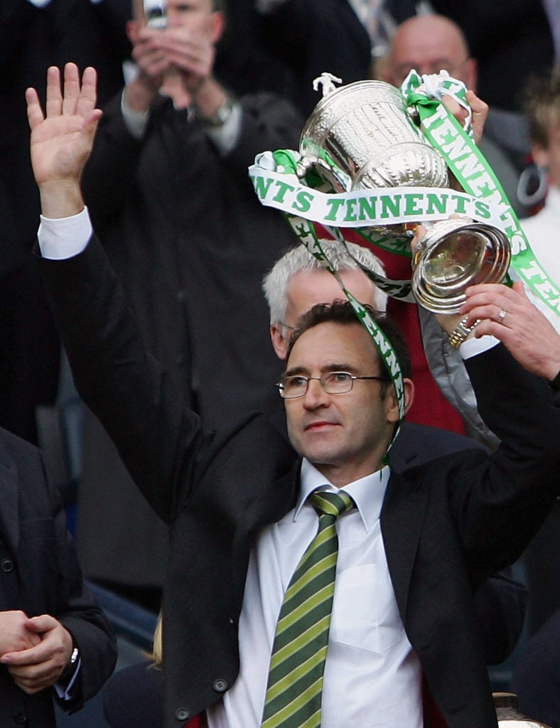 Martin O'Neill of Celtic celebrates with the trophy during The Tennents Scottish Cup Final between Celtic and Dundee United at Hampden Park