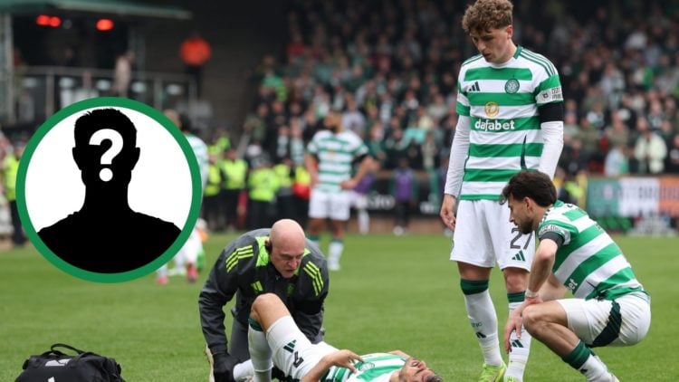An injured Jota lays on the pitch at Tannadice Park during Celtic's Premiership clash at Dundee United