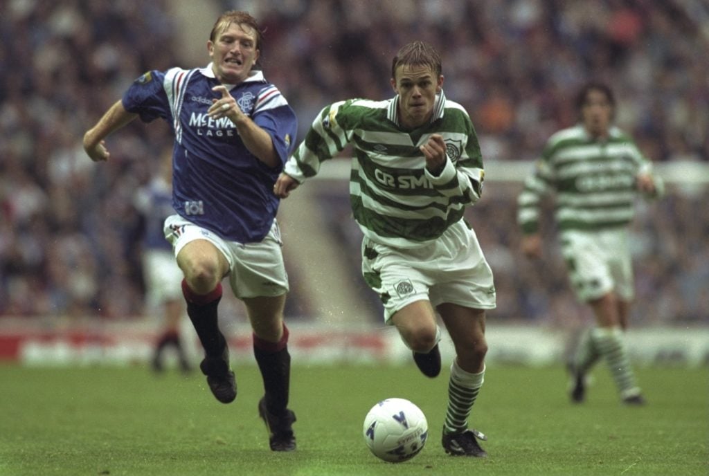 Stuart McCall (left)of Glasgow Rangers and Simon Donnelly (right) of Celtic running after the ball