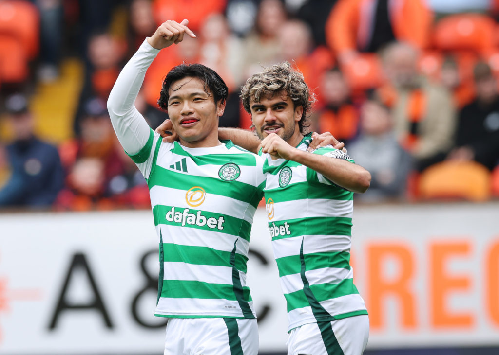Jota and Reo Hatate celebrate Celtic's goal vs Dundee United