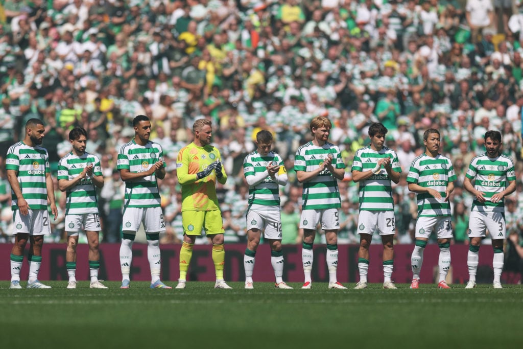 Celtic fans take part in a minute's applause before the game against St Mirren