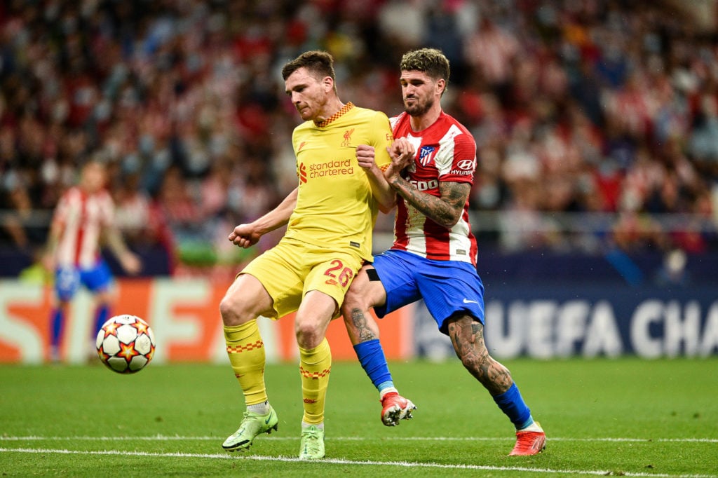 Andrew Robertson and Rodrigo de Paul during UEFA Champions League match between Atletico de Madrid and Liverpool FC at Wanda Metropolitano