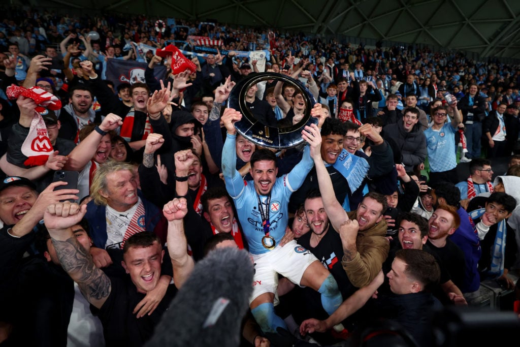 Marco Tilio of the City celebrates with the Championship Trophy after winning the A-League Men Grand Final match between Melbourne City and Melbourne Victory at AAMI Park