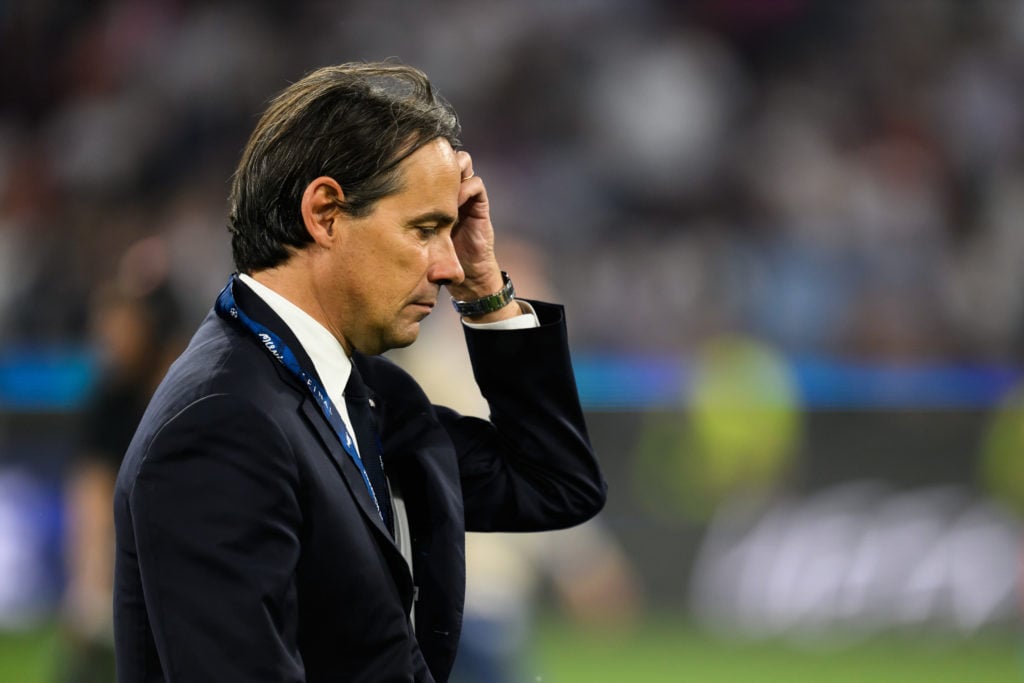 Simone Inzaghi walks off after Inter's 5-0 defeat to Paris Saint-Germain in the Champions League final.