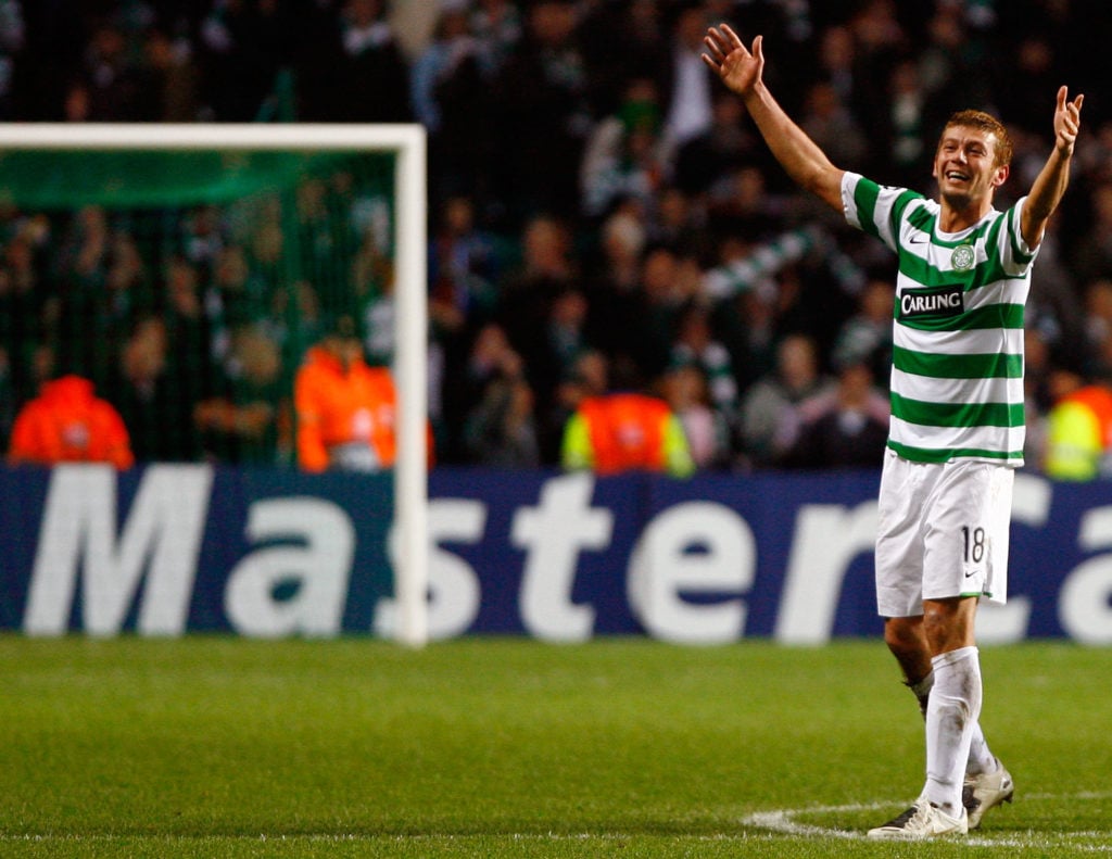 Massimo Donati lifts his arms out to the Celtic crowd after scoring the winner against Shakhtar Donetsk in the Champions League at Celtic Park