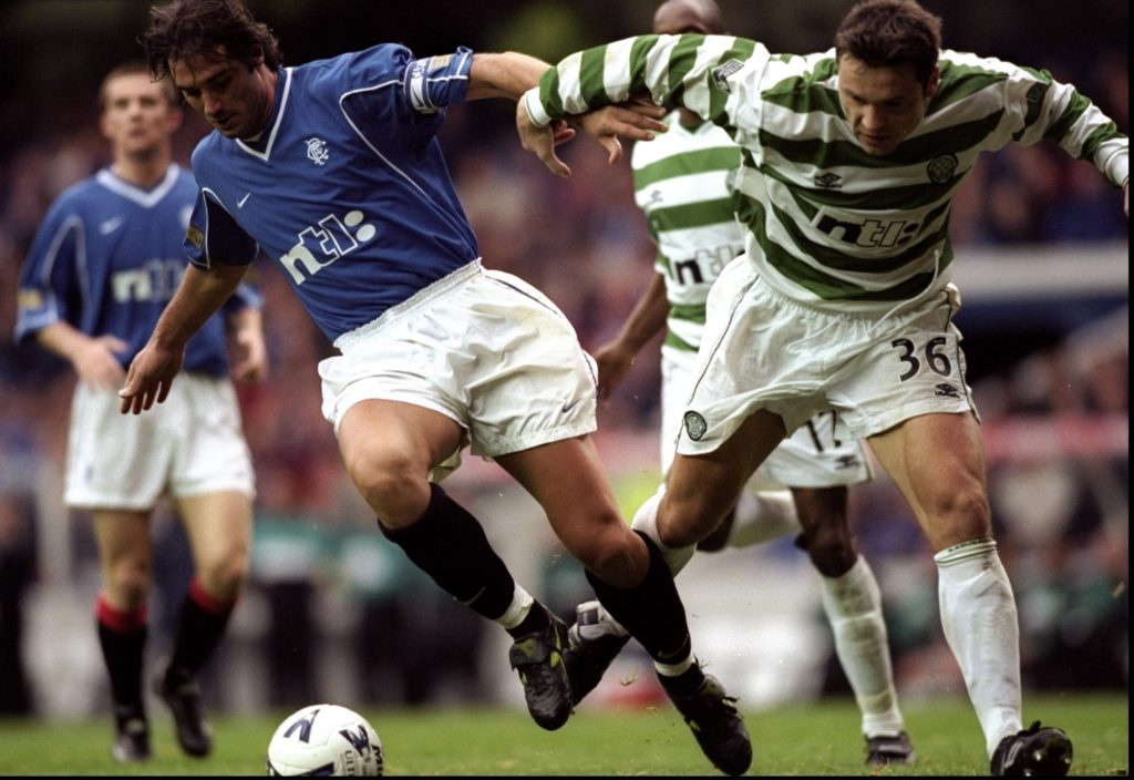 Lorenzo Amoruso of Rangers shrugs off Mark Viduka of Celtic in the Scottish Premier League match at Ibrox