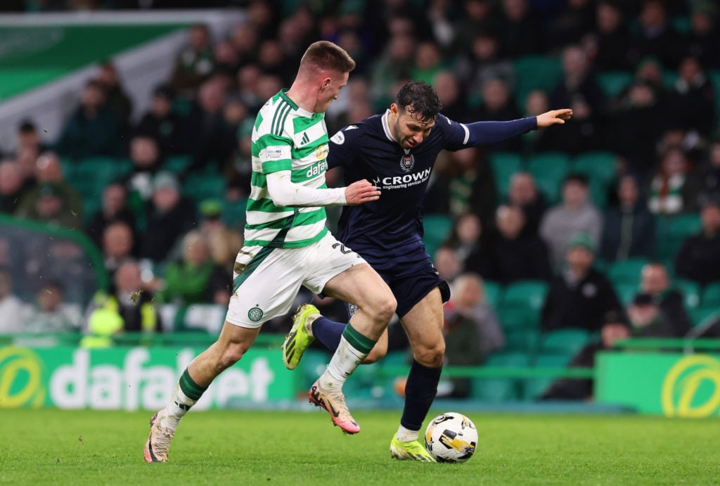 Johnny Kenny of Celtic battles for possession with Juan Antonio Portales of Dundee FC