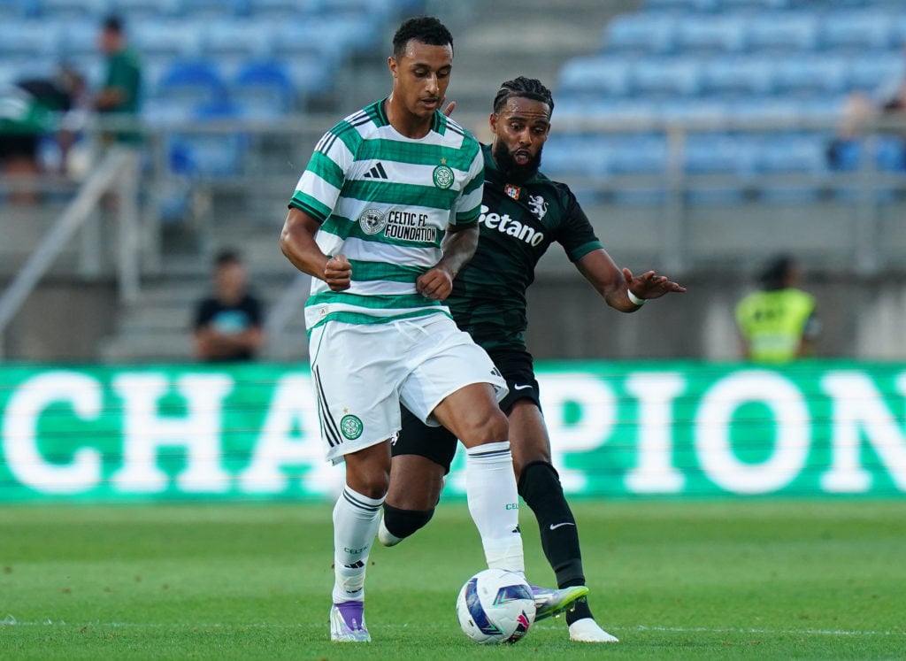 Adam Idah gets to the ball ahead of Jeremiah St. Juste of Sporting CP in Celtic's pre-season friendly
