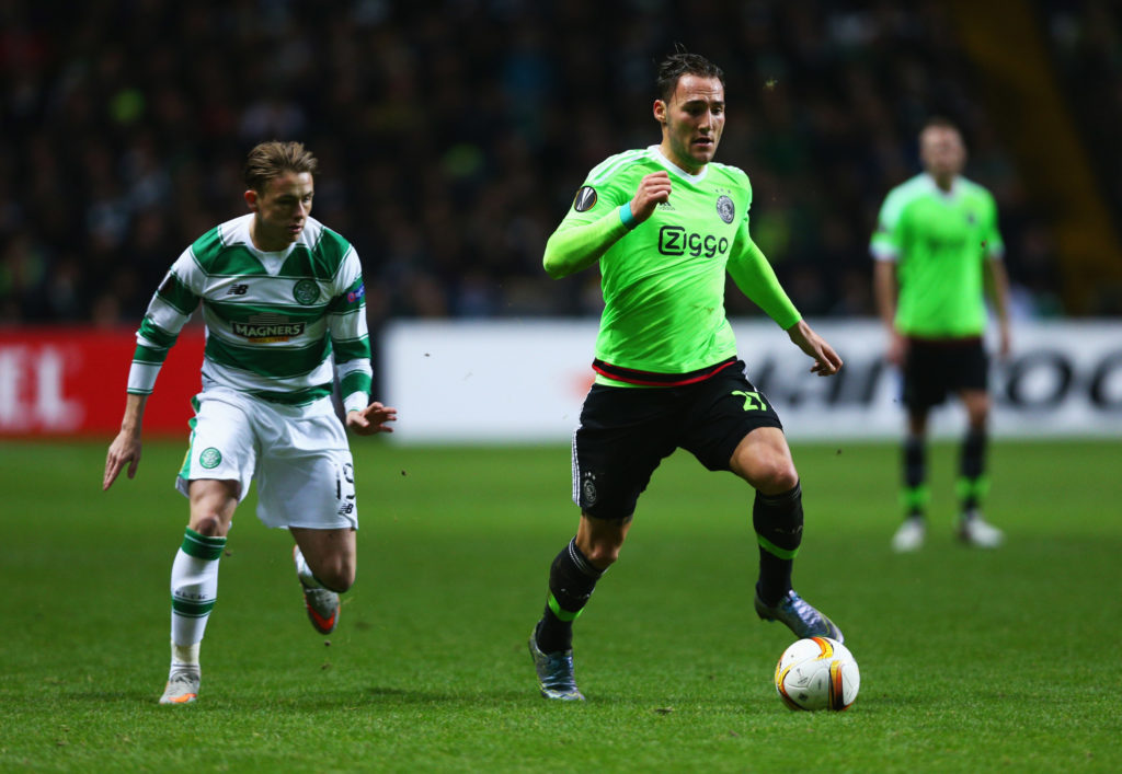 Nemanja Gudelj of Ajax is chased by Scott Allan of Celtic during the UEFA Europa League Group A match between Celtic FC and AFC Ajax at Celtic Park