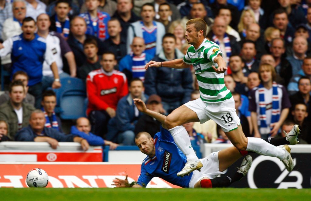 Massimo Donati tackles Alan Hutton during Rangers vs Celtic
