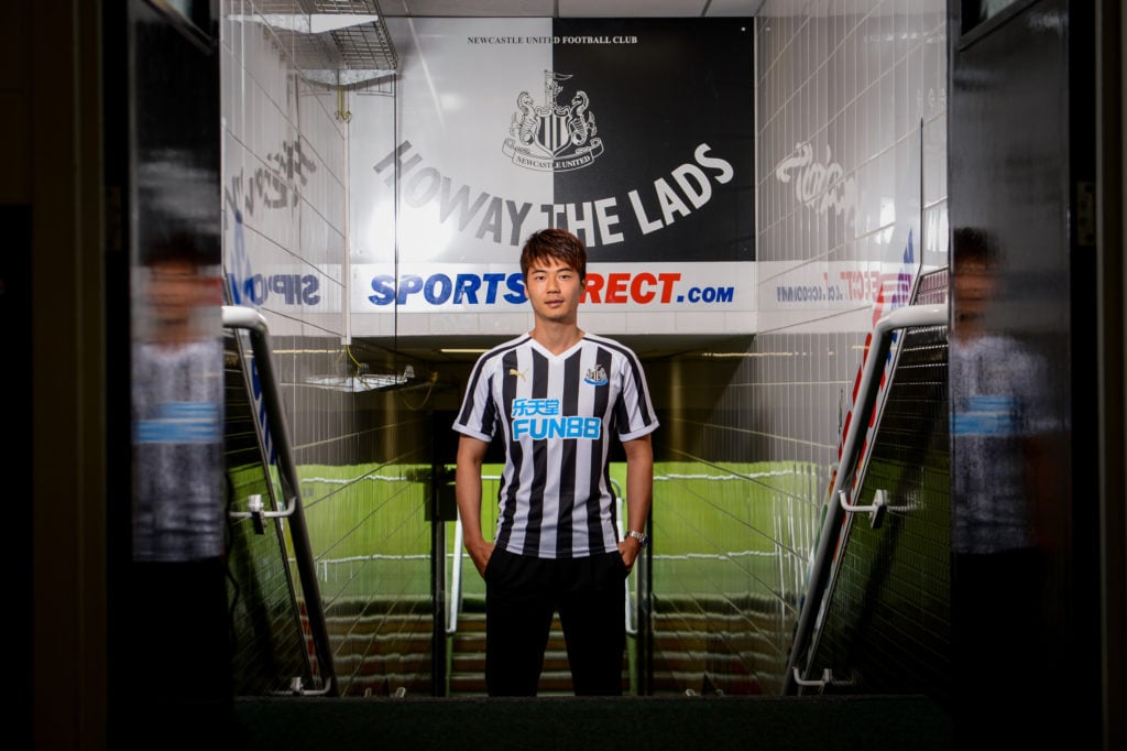 Ki Sung-yueng poses for photographs after signing for Newcastle United at St.James' Park