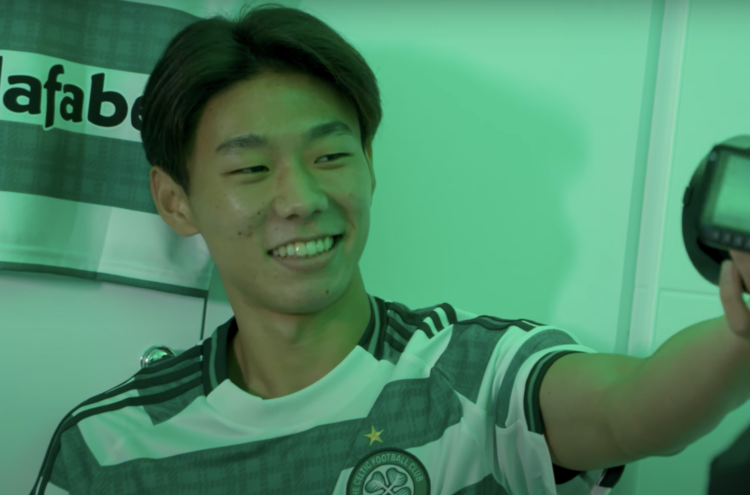 Hayato Inamura smiles after being announced as a Celtic player