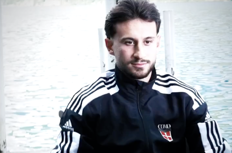 Nicolas Kuhn gets his picture taken in a Como tracksuit after signing for the club from Celtic
