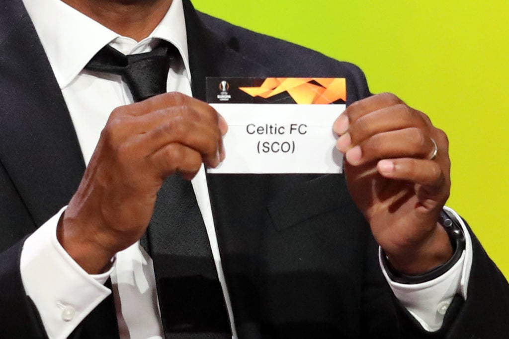 Former Netherlands midfielder Aron Winter holds the slip of Celtic FC during the draw for UEFA Europa League football tournament at The Grimaldi Forum in Monaco