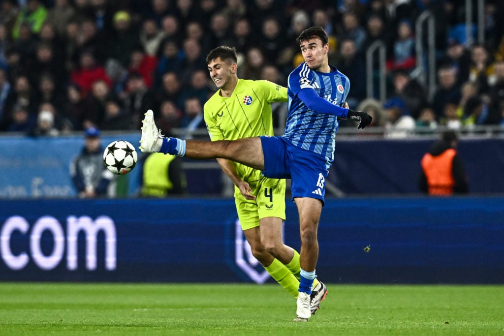 David Strelec of Slovan Bratislava and Raul Torrente of Dinamo Zagreb compete for the ball
