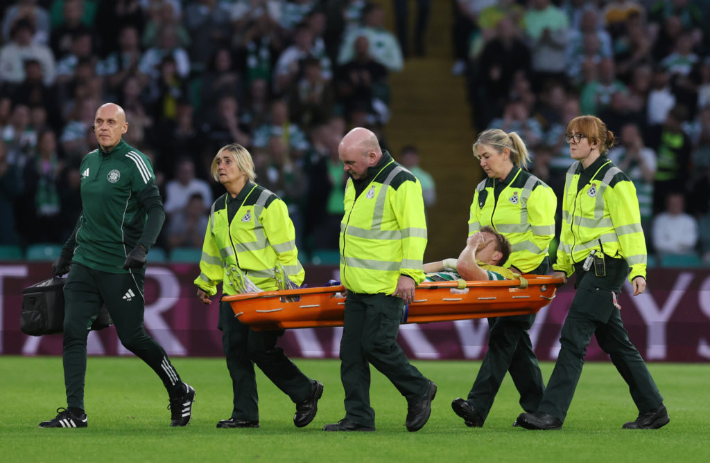 Alistair Johnston of Celtic is stretchered off after sustaining an injury